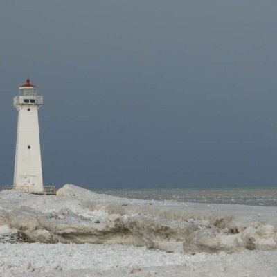 The working lighthouse at the end of the pier has an eerie beauty in wintertime.